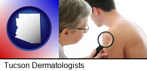 Tucson, Arizona - a dermatologist examines a mole on a male patient
