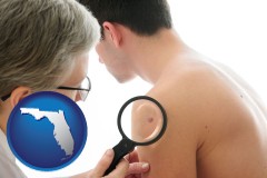 florida map icon and a dermatologist examines a mole on a male patient