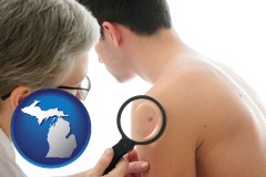 michigan map icon and a dermatologist examines a mole on a male patient