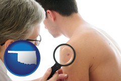 oklahoma map icon and a dermatologist examines a mole on a male patient