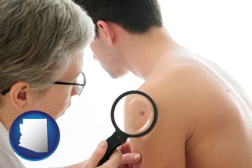 a dermatologist examines a mole on a male patient - with Arizona icon