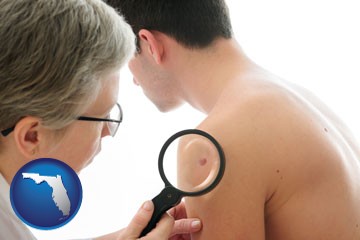 a dermatologist examines a mole on a male patient - with Florida icon